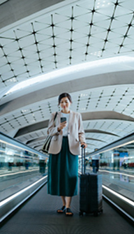Woman on phone in international airport