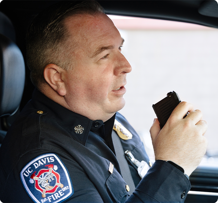 UC Davis Fire Chief using a push-to-talk device while inside a vehicle