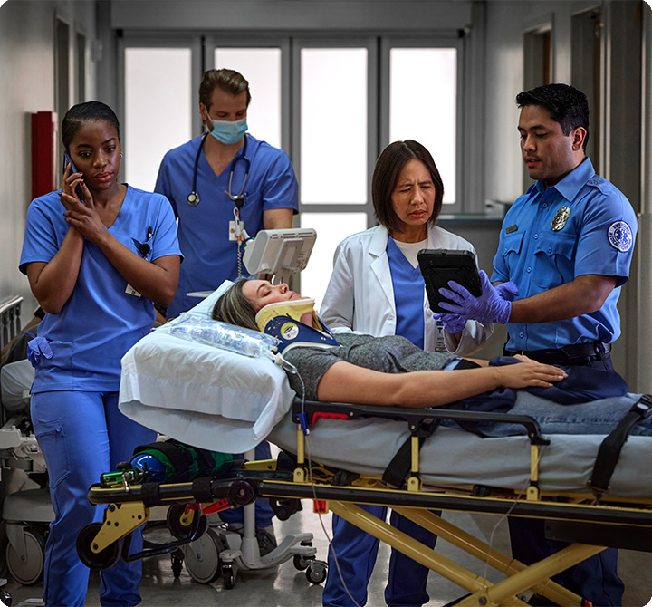 FirstNet Emt and doctors receiving patient in emergency care