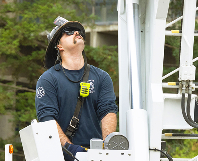 Firefighter on top of truck