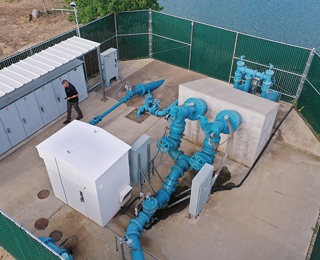 A Del Oro Water Company employee, Jim Roberts, works at a pump site near Magalia, CA. The water company switched to FirstNet for its connectivity needs when the Camp Fire destroyed its terrestrial internet line to the Magalia office. Now employees will be able to use their smartphones for entering data and for push to talk.