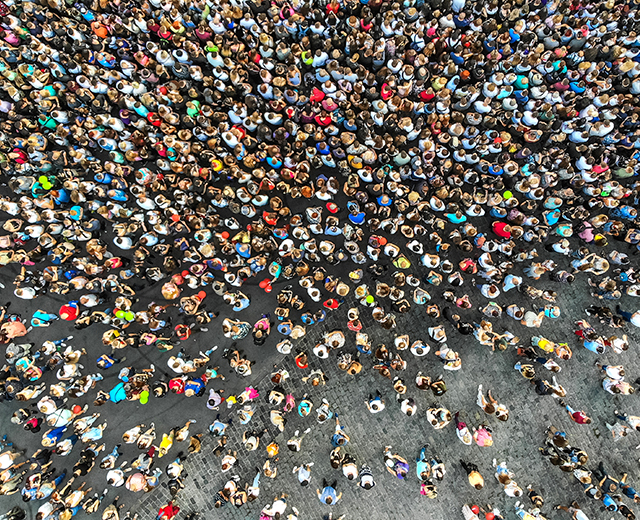 Aerial. Interested crowd of people in one place. Top view from drone.