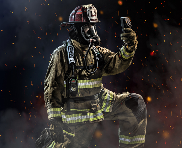 Fireman kneeling holding LUNA device