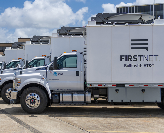 FirstNet - Satellite COLTs (Cell On Light Trucks) lined up in parking lot.