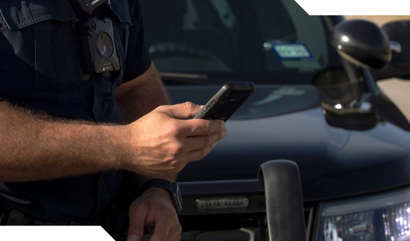 Law enforcement closeup with device